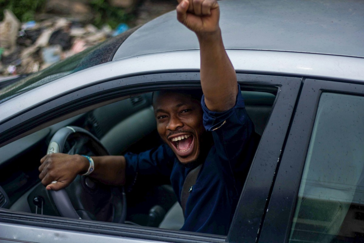 man happy driving car